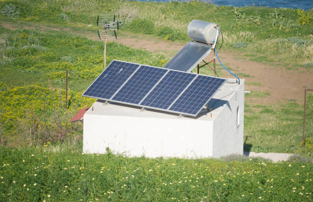 Europe, Greece, 2018: View Of Small Modern Greek House With Solar Panels And Solar Water Heater On Roof
