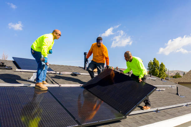A team of workers installing solar panels on a home in Orlando Florida