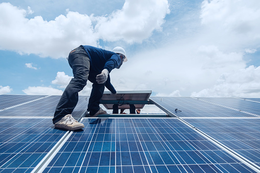 engineer team working on replacement solar panel in solar power plant;engineer and electrician team swapping and install solar panel ; electrician team checking hot spot on break panel