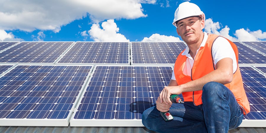 solar contractor on a tile rooftop in Orlando Florida, installed solar PV panels