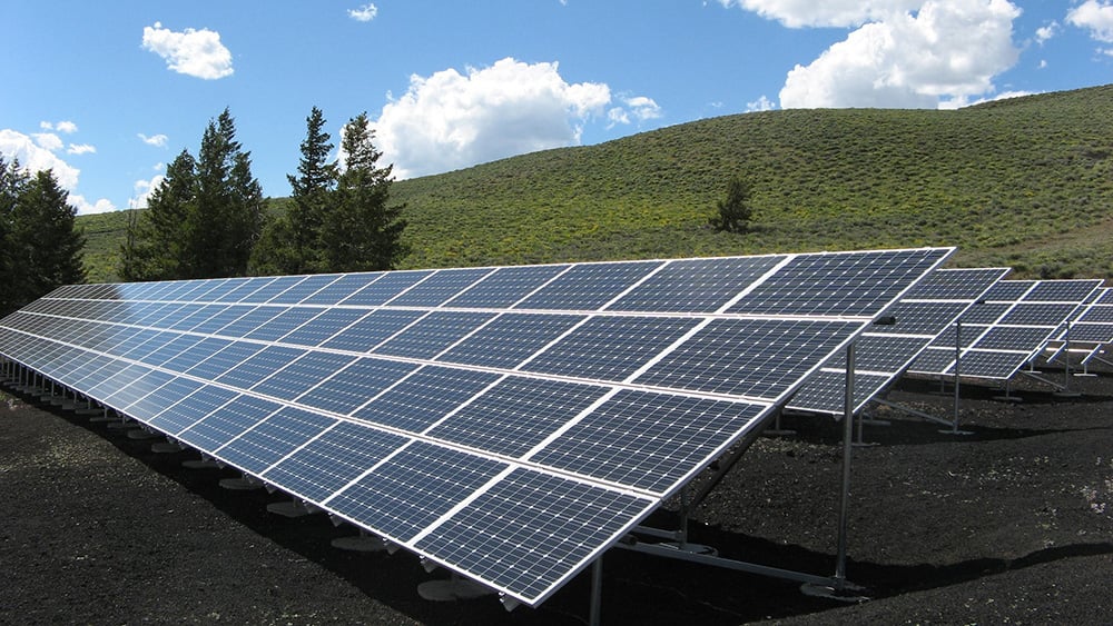 solar pv panels installed in field on hillside in Orlando Florida