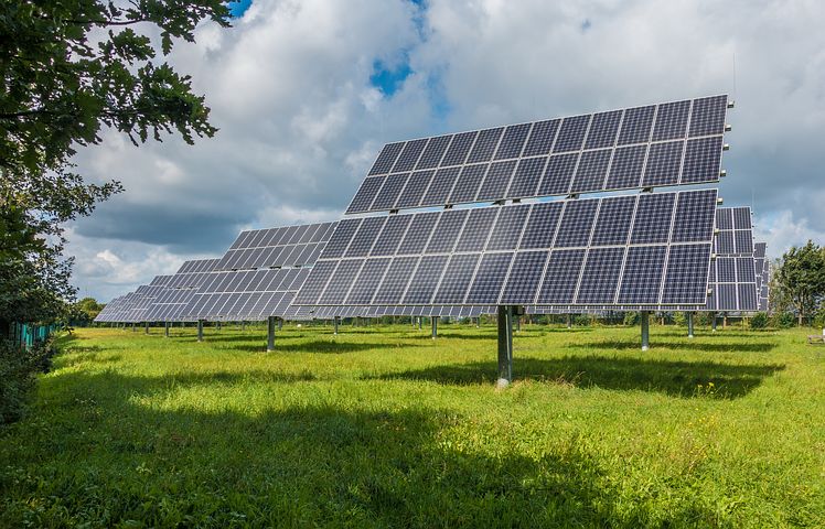 commercial solar panels installed in grass garden